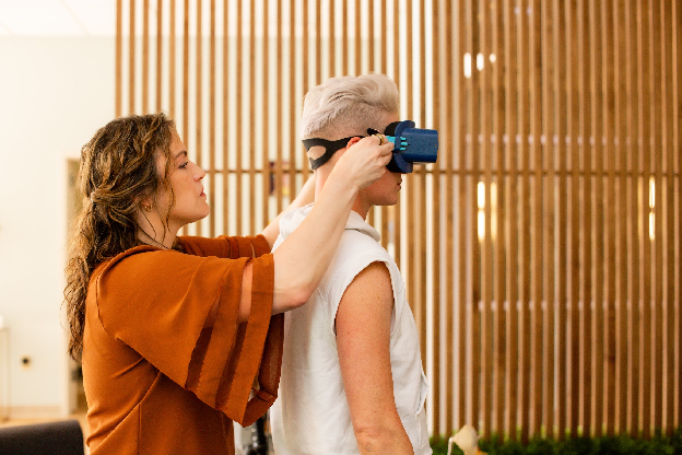 Dr. Blair Hobble fitting infrared goggles on a patient